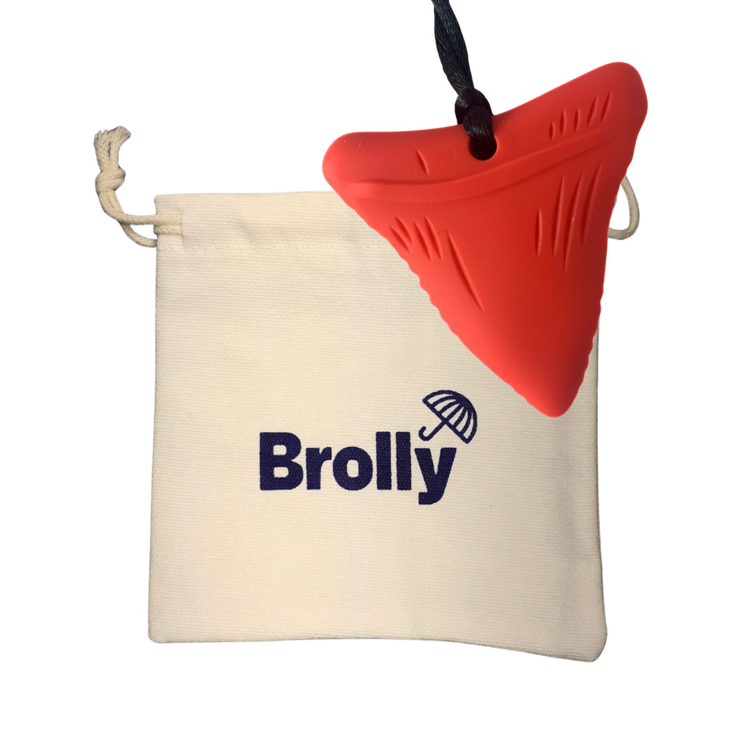Beige drawstring pouch and Shark Tooth-shaped Brolly Chew Necklace on a black cord against a white background - Red