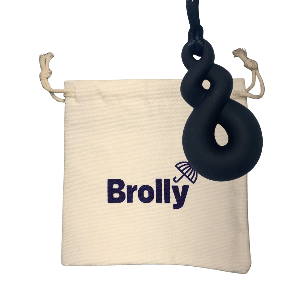 Beige drawstring pouch and Twist-shaped Brolly Chew Necklace on a black cord against a white background - Black