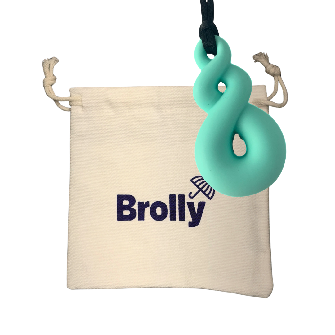 Beige drawstring pouch and Twist-shaped Brolly Chew Necklace on a black cord against a white background - Teal