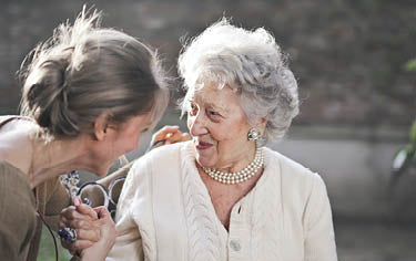 Mother and Daughter smile at each other