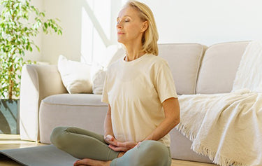 elderly women doing meditation