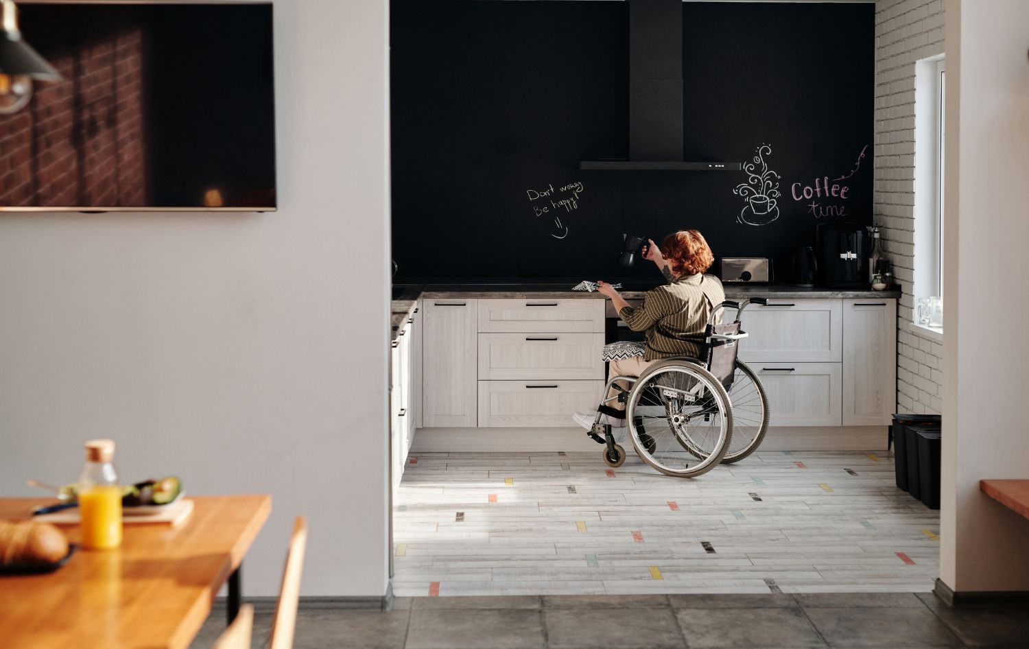 Disability lady on wheelchair writing black board