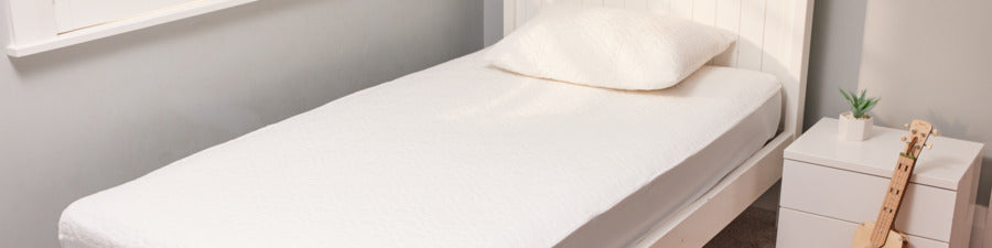 waterproof bed pad in adults room