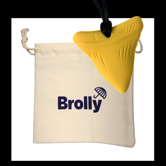 Beige drawstring pouch and Shark Tooth-shaped Brolly Chew Necklace on a black cord against a white background - Blue