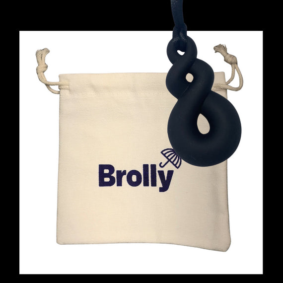 Beige drawstring pouch and Shark Tooth-shaped Brolly Chew Necklace on a black cord against a white background - Blue